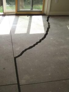 Floor cracks may be caused by settlement of the permimeter foundation. Settlement will produce a void that can not support the concrete above it.